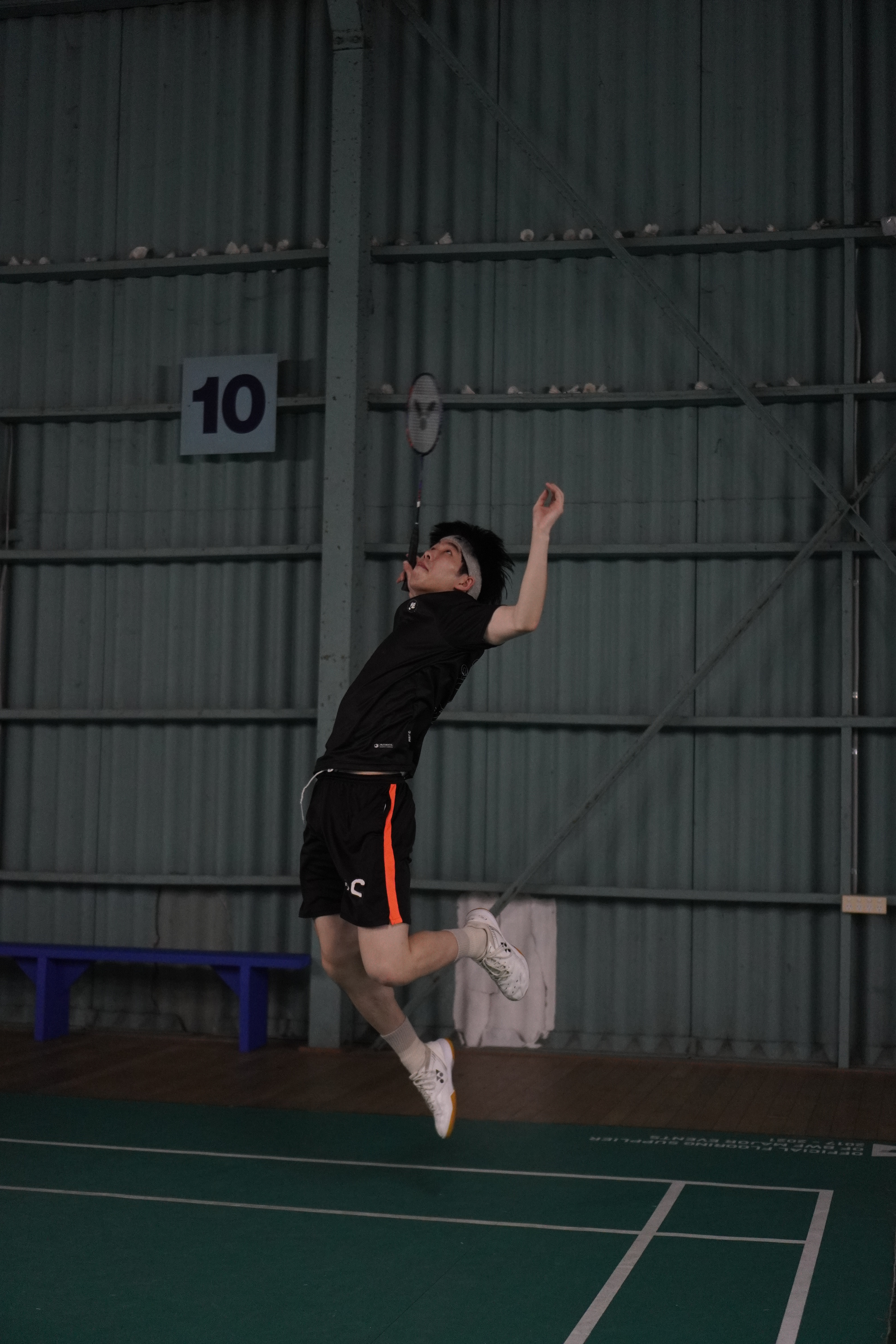 Person smashing shuttlecock